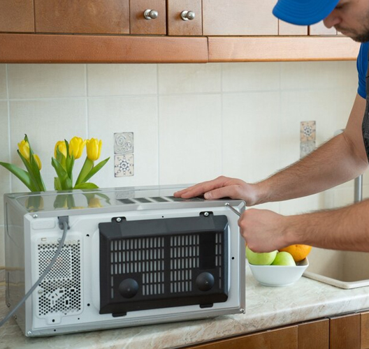 Skilled Technician Providing Reliable Microwave Repairs Experienced Microwave Oven Technicians